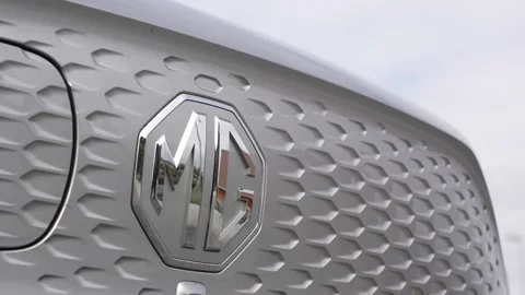 Close up of MG logo and front grill on a MG ZS EV car Stock Footage 202260650