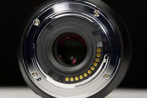 Close-up of Micro Four Thirds MFT macro lens mount on black background show.. Stock Photos