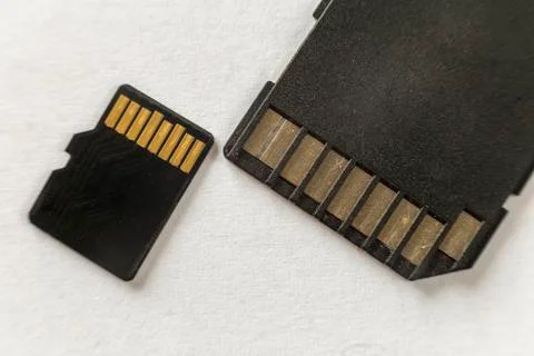 Close-up of micro SD memory card and SD adapter isolated on white copy space  Stock Photos