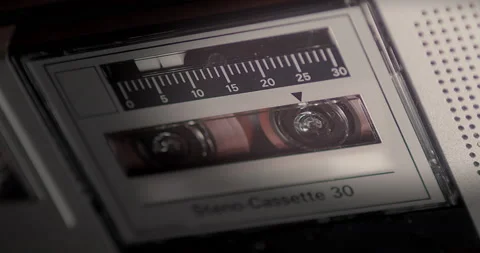 Close-up of the microcassette and the rolling tape in the recorder. Camera Stock Footage 200814713