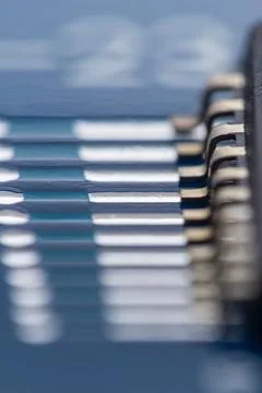Close-up of microchip with metallic pins and blue casing Stock Photos
