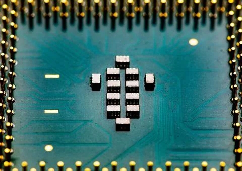 Close up of microchips and pins on Main CPU PC processor circuit board. Foto stock