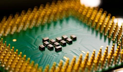 Close up of microchips and pins on Main CPU PC processor circuit board. 스톡 사진