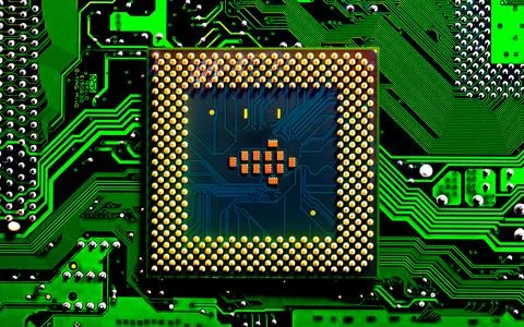 Close up of microchips and pins on Main CPU PC processor circuit board.. 写真素材