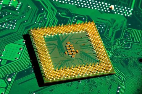 Close up of microchips and pins on Main CPU PC processor circuit board.. 스톡 사진