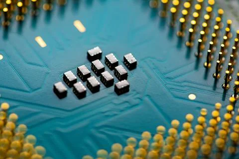 Close up of microchips and pins on Main CPU PC processor circuit board. Stock Photos