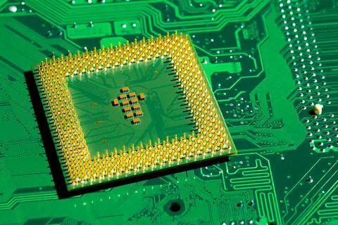 Close up of microchips and pins on Main CPU PC processor circuit board.. 스톡 사진