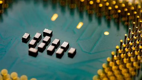 Close up of microchips and pins on Main CPU PC processor circuit board. 写真素材