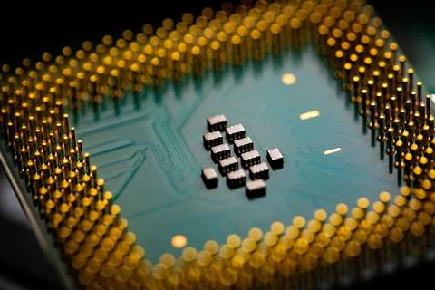 Close up of microchips and pins on Main CPU PC processor circuit board. Foto stock
