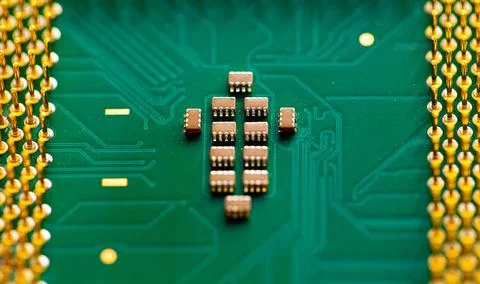 Close up of microchips and pins on Main CPU PC processor circuit board. Stock Photos