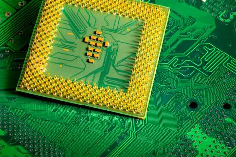 Close up of microchips and pins on Main CPU PC processor circuit board.. 스톡 사진