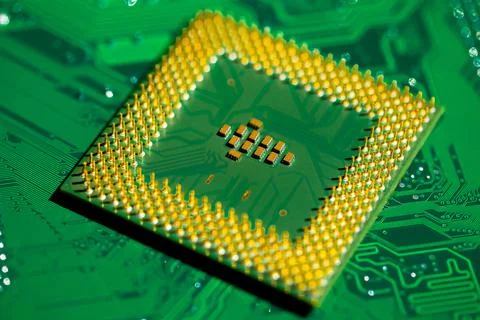 Close up of microchips and pins on Main CPU PC processor circuit board.. 스톡 사진