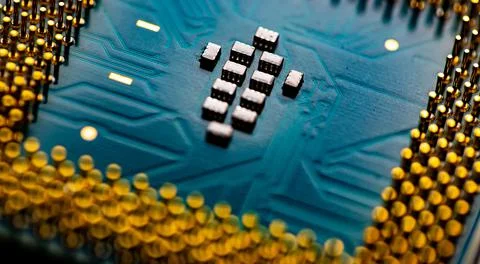 Close up of microchips and pins on Main CPU PC processor circuit board. Stock Photos