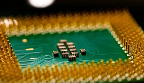Close up of microchips and pins on Main CPU PC processor circuit board. Stockfoto's
