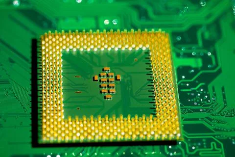 Close up of microchips and pins on Main CPU PC processor circuit board.. Stockfoto's