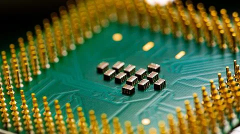 Close up of microchips and pins on Main CPU PC processor circuit board. 写真素材