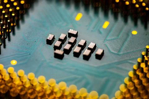 Close up of microchips and pins on Main CPU PC processor circuit board. 스톡 사진