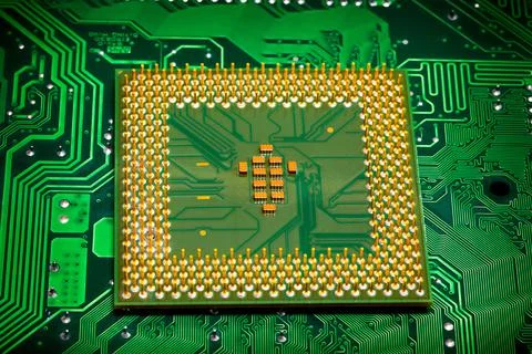 Close up of microchips and pins on Main CPU PC processor circuit board.. 스톡 사진