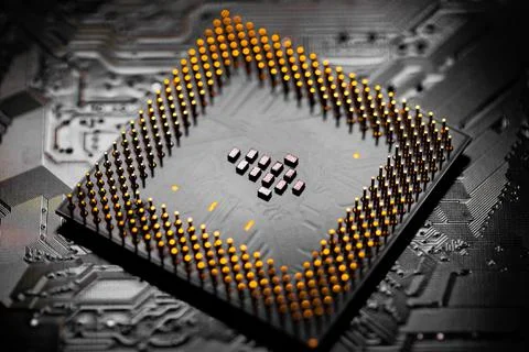 Close up of microchips and pins on Main CPU PC processor circuit board.. Stock Photos