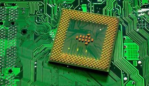 Close up of microchips and pins on Main CPU PC processor circuit Stock Photos
