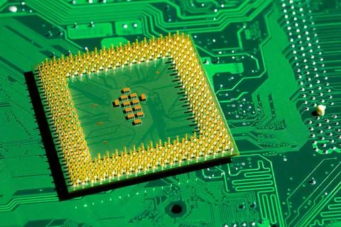 Close up of microchips and pins on Main CPU PC processor circuit board. Ma... Stock Photos