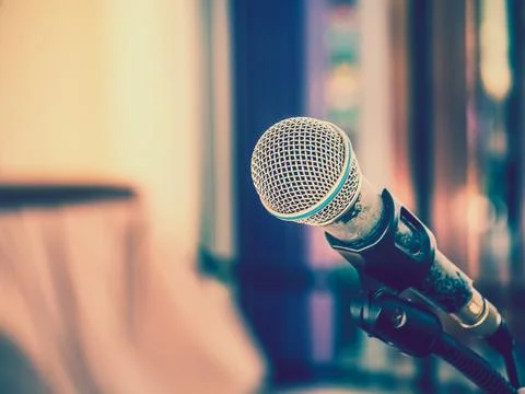 Close up of microphone on abstract blurred background for speech in seminar.. Stock Photos