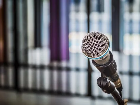 Close up of microphone on abstract blurred background for speech in seminar.. Stock Photos