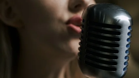 Close-up of Microphone and Talented Singer at Background. Shot on Red Epic 4k Stock Footage 116247657