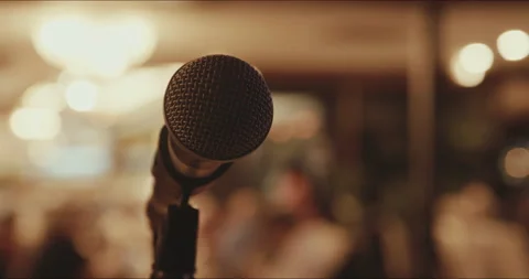 Close up Microphone with audience in background Stock Footage 204074253