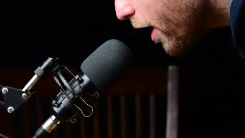Close up microphone podcaster lips speaking to the mice on air broadcasting Video stock 257458110