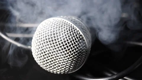 Close up on microphone smoke swirling on Mic in slow motion Stock Footage 204062844