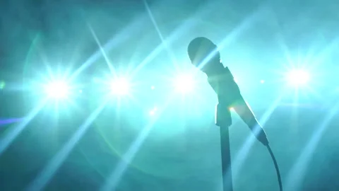 Close-up of microphone on stage against the background of concert lighting. Stock Footage 95480317
