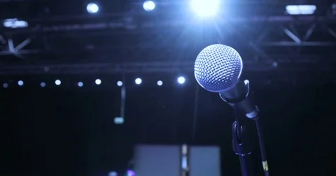 Close up Microphone on Stage at conference, Spotlight, Backlight. Waiting For Stock Footage 80742078