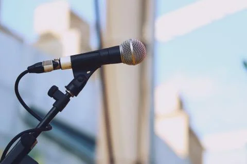 Close up of microphone on stage daylight background Stock Photos