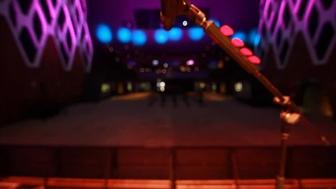 Close-up of a microphone on stage  at empty venue during sound check Stock Footage 90638979