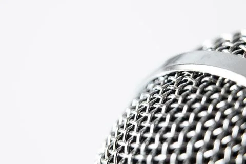 Close-up of microphone on white background with empty space for text, composi Stock Photos
