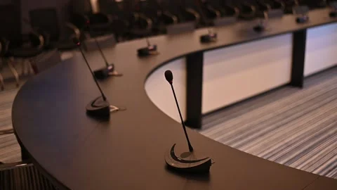 Close-up of microphones in an empty meeting room at a press conference. Stock Footage