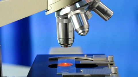 Close up of Microscope on the blue background Stock Footage 54641268