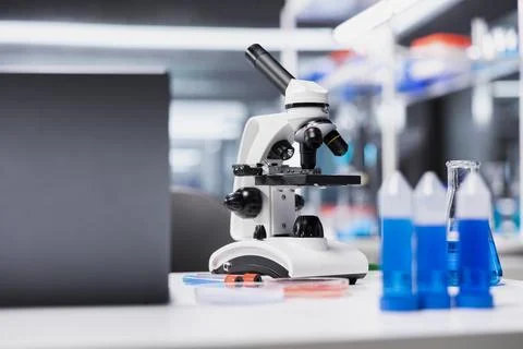 Close up of microscope in empty lab used for examining stained tissue sections Stock Photos