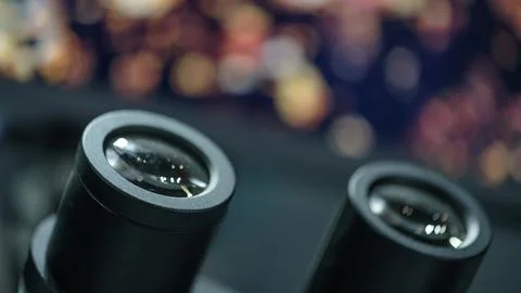 Close-up of  microscope eyepieces against blurred background displaying objec 写真素材