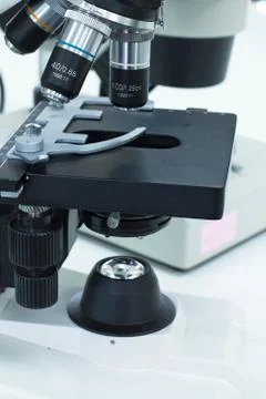 Close up of microscope lenses focused on a specimen Stock Photos