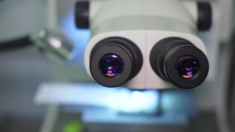 Close-up of microscope lenses. Microscope - front view. Medical equipment for Stock-Footage 315761186