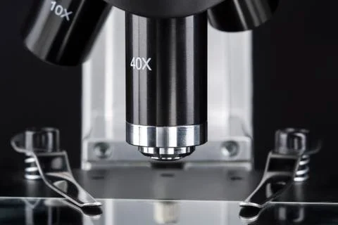 Close up of a microscope slide with black background Stock Photos