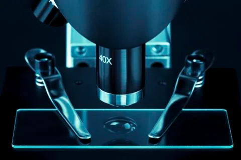 Close up of a microscope slide with black background Stock Photos