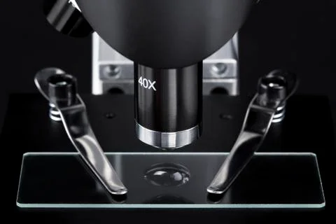 Close up of a microscope slide with black background Stock Photos