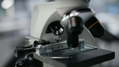 Close up of microscope on workbench in sterile empty hospital laboratory Stock Footage 325917717