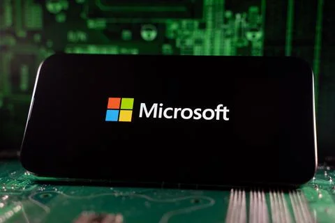 Close up of Microsoft logo on device with circuit board background. Toronto, Foto stock