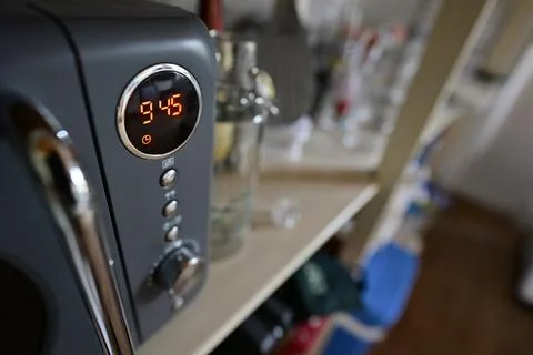 Close-up of Microwave Oven Displaying Time 9:45 스톡 사진
