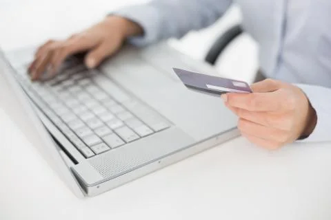 Close up mid section of a woman doing online shopping Stock Photos