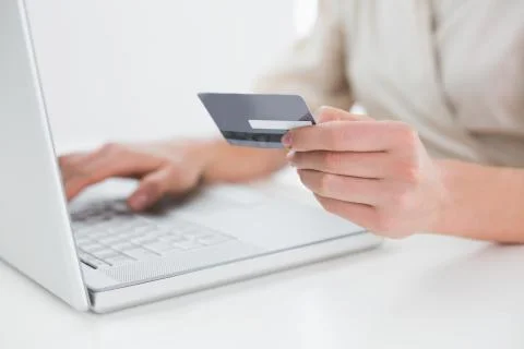 Close up mid section of woman doing online shopping Stock Photos